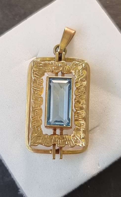 `ELECTRICK BLUE TOPAZ`  Set in a 9CT Yellow Gold Pendant (Genuine Gold)