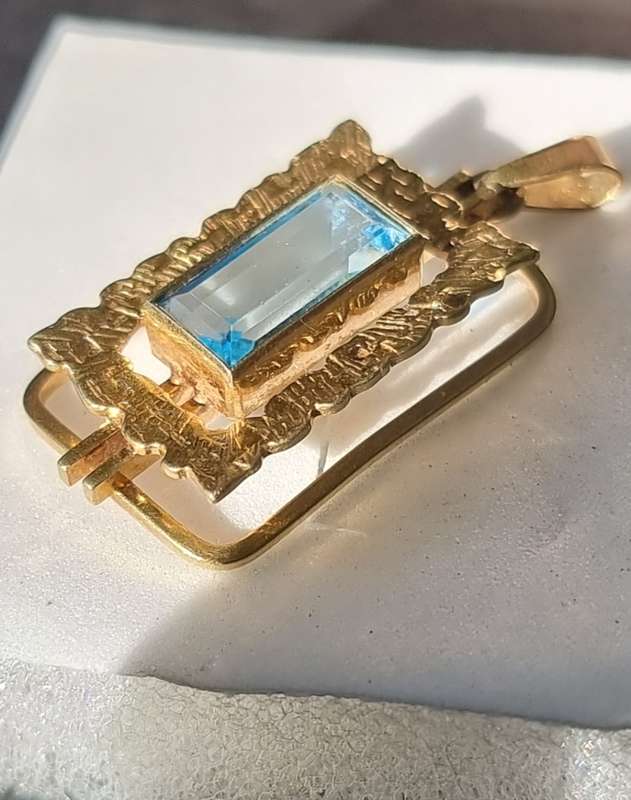 `ELECTRICK BLUE TOPAZ`  Set in a 9CT Yellow Gold Pendant (Genuine Gold)