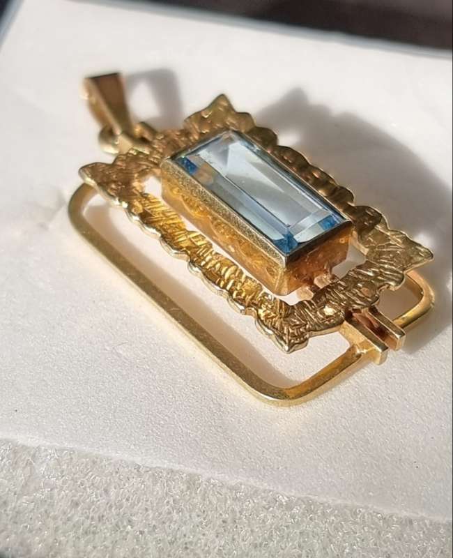 `ELECTRICK BLUE TOPAZ`  Set in a 9CT Yellow Gold Pendant (Genuine Gold)