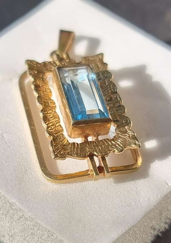 `ELECTRICK BLUE TOPAZ`  Set in a 9CT Yellow Gold Pendant (Genuine Gold)