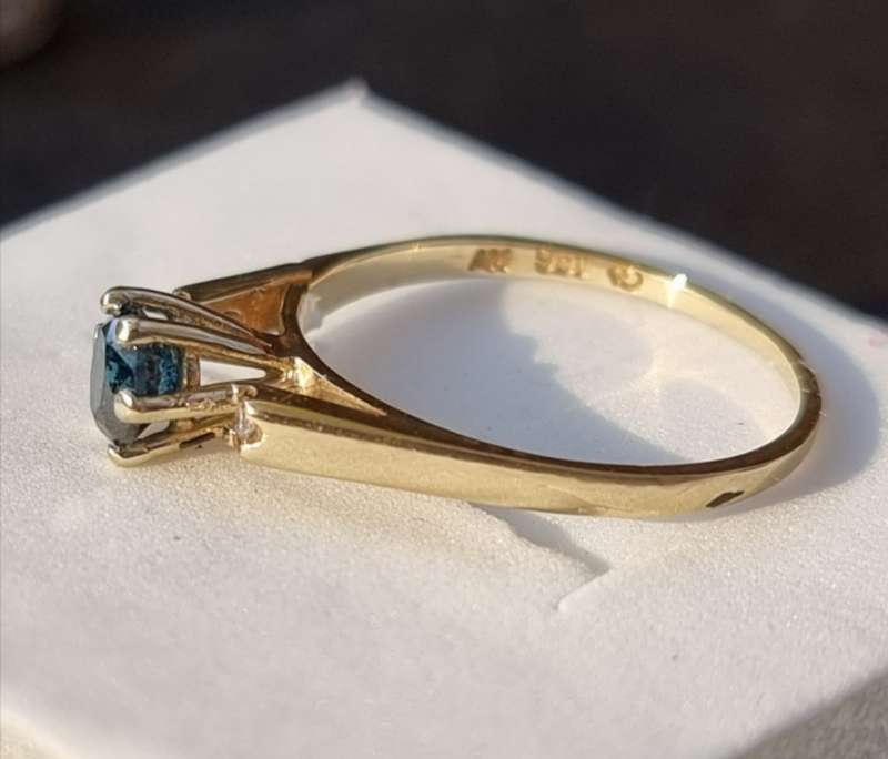 0.56 carat certified fancy green diamond engagement ring set in 9ct yellow gold