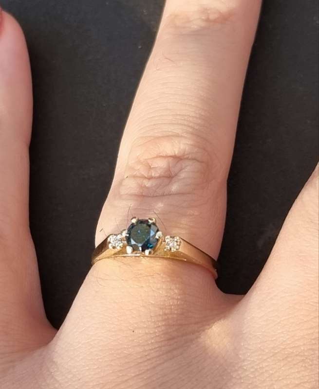 0.56 carat certified fancy green diamond engagement ring set in 9ct yellow gold