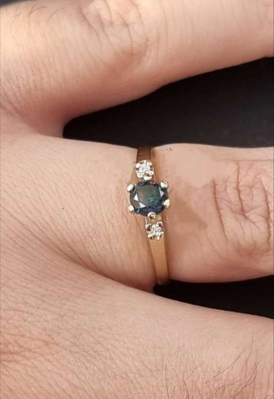 0.56 carat certified fancy green diamond engagement ring set in 9ct yellow gold