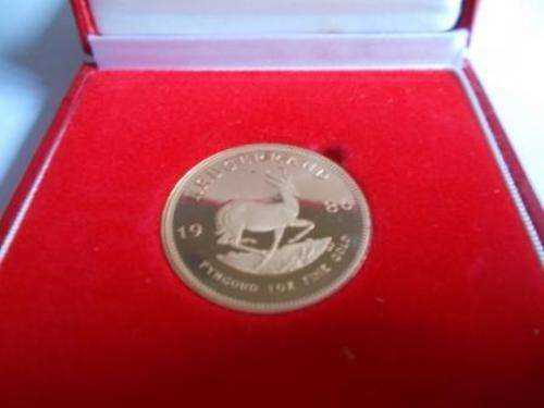 1986  1 OZ KRUGER RAND ( NEW ) IN S.A.M BOX. 22 CT FINE GOLD