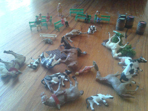 Cows, Horses, People on Benches and Drums