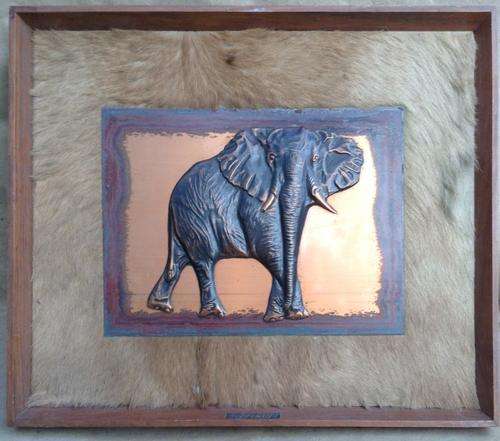 Chased Copper, Elephant mounted on Masonite with real skin surround.   Postage R49.00