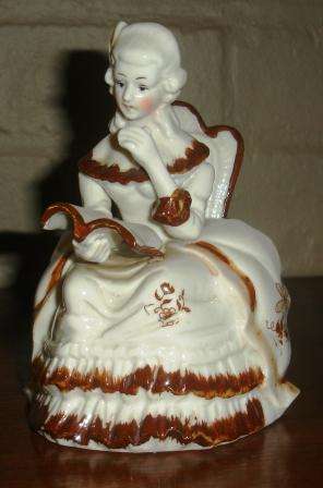 "Singing Lady" porcelain figurine. Approx. 16cmH x 11cmW