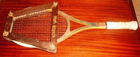 Retro "Slazenger" Tennis Raquet in Frame.Well used. Approx. 70cmL x 30W