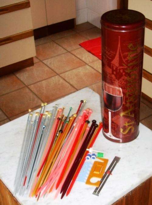 Retro knitting needles & other items in tin container