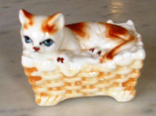 Cat on basket ornament