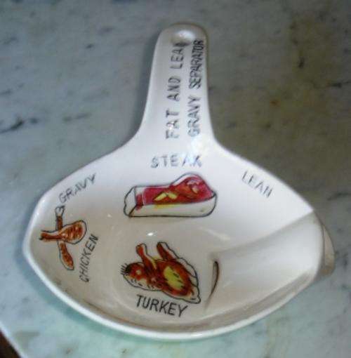 Retro gravy boat separator(has small chip underspout .this does no detract from looks or usage)