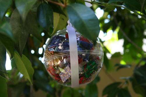 Clear plastic baubles. Approx. 9cm wide.  Fill with goodies and hang on the tree