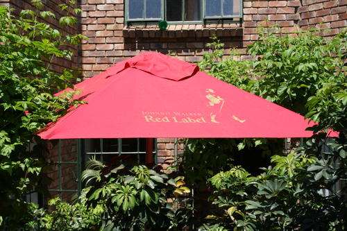 Umbrella for the garden with cement stand