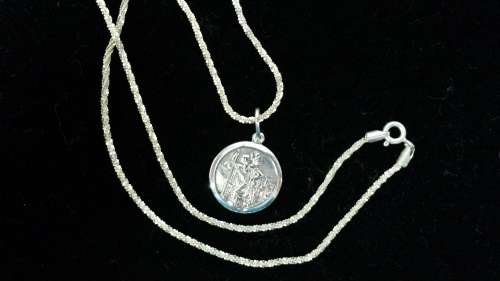 STERLING SILVER NECKLACE PLUS ST CHRISTOPHER PENDANT.