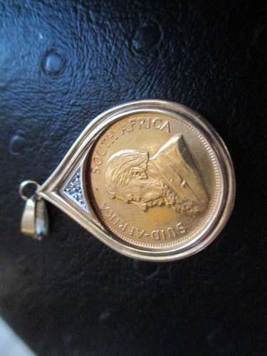 1/4 OUNCE KRUGER RAND BEAUTIFULLY SET IN PENDANT WITH YELLOW GOLD, WHITE GOLD AND DIAMONDS