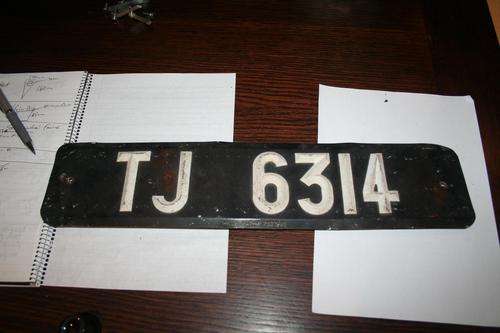TJ Number Plate - Black and White a classic and great condition to boot