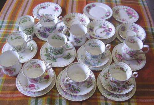PARTIAL ROYAL ALBERT CUPS SAUCERS AND SMALL PLATES