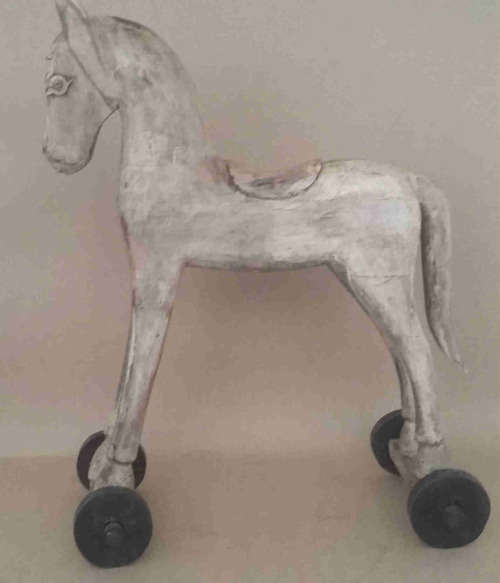 Wooden horse on wheels