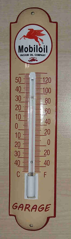 Mobil metal enamel thermometer.