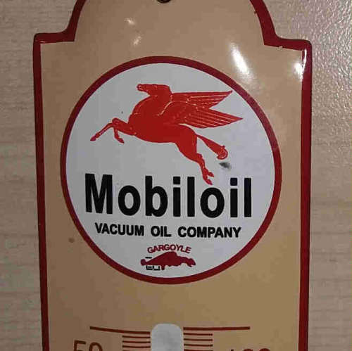 Mobil metal enamel thermometer.