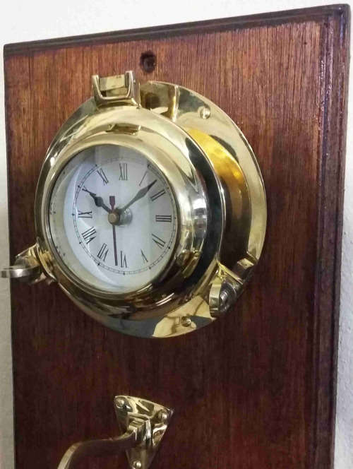 Solid brass bell and nautical clock. Bell 15cm diameter clock 15cm