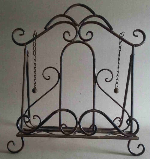 Wrought metal book stand.