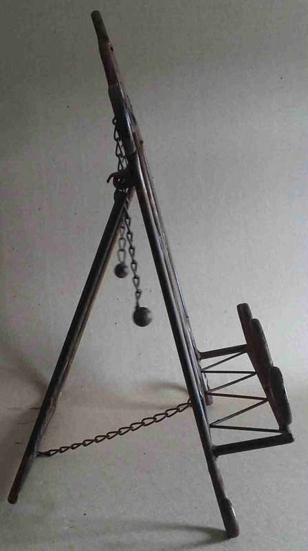 Wrought metal book stand.