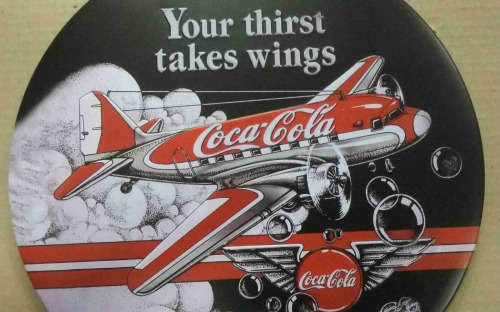 Coca-Cola your Thirst Takes Wings metal sign