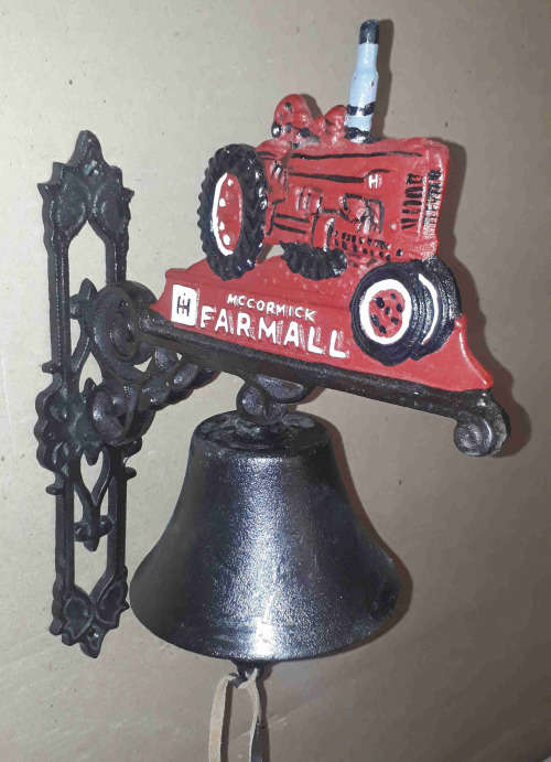 Farmall cast iron wall mounted bell.