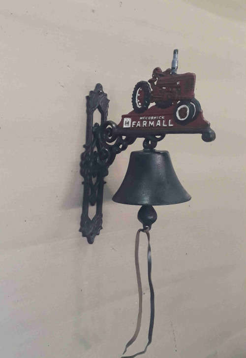Farmall cast iron wall mounted bell.