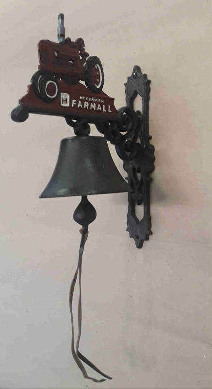 Farmall cast iron wall mounted bell.
