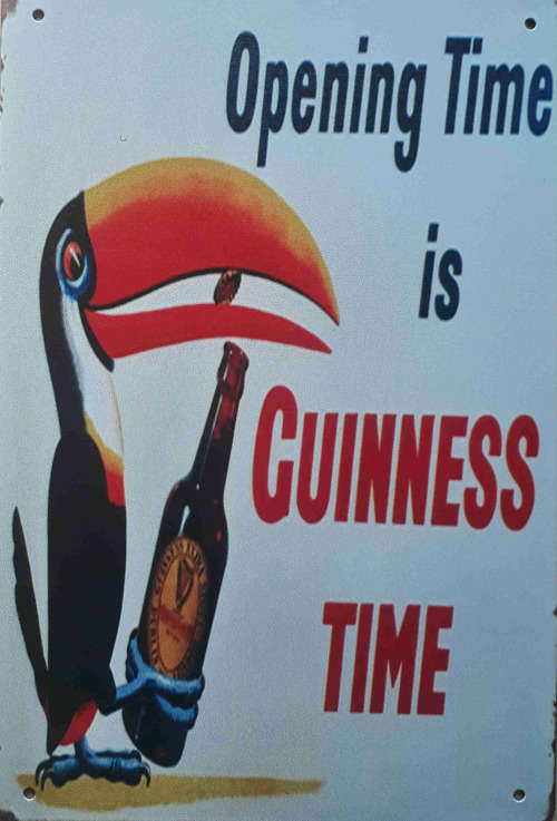 Guinness opening time metal sign.