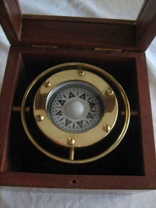 Gimbaled brass compass in wooded box