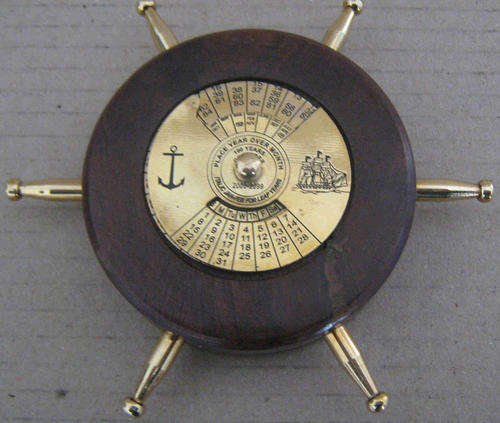 40 year calander, brass and wood