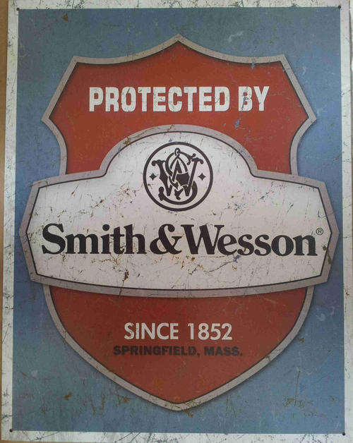 Smith & Wesson revolvers distressed metal sign