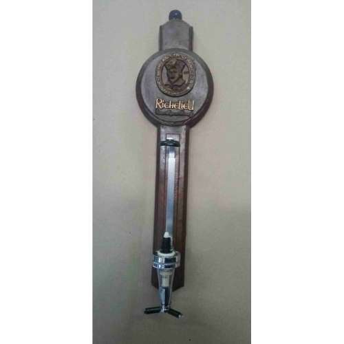 Single optic spirit tot measure dispenser on Richelieu backing. Wall hanging.