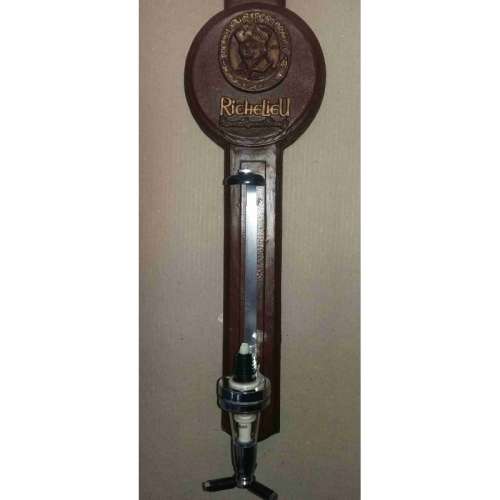 Single optic spirit tot measure dispenser on Richelieu backing. Wall hanging.