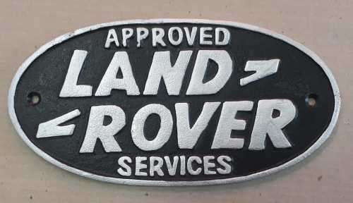 Land rover cast iron sign.