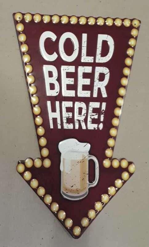 Cold beer here embossed metal sign