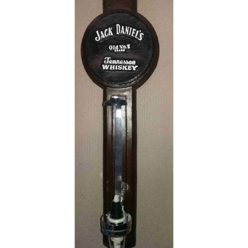 Single optic spirit tot measure dispenser on Jack Daniel`s  backing. Wall hanging.