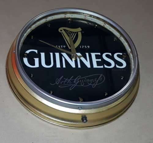 Guinness illuminated metal clock. 31cm diameter.