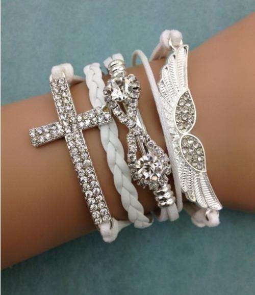 Bracelet-Cross, diamond bow and angel wings charm