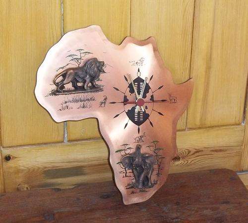 Africa red copper and bronze wall clock. U.T.S German quartz movement Size 28 X 25 cm