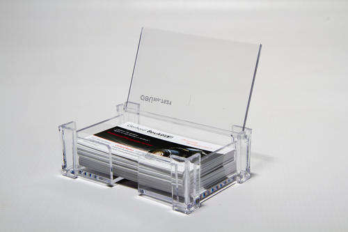 Business card holder with lid that opens and closes.