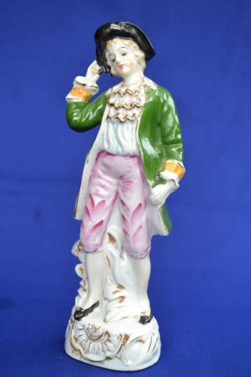 Porcelain Figure of a Young Man In Period Dress