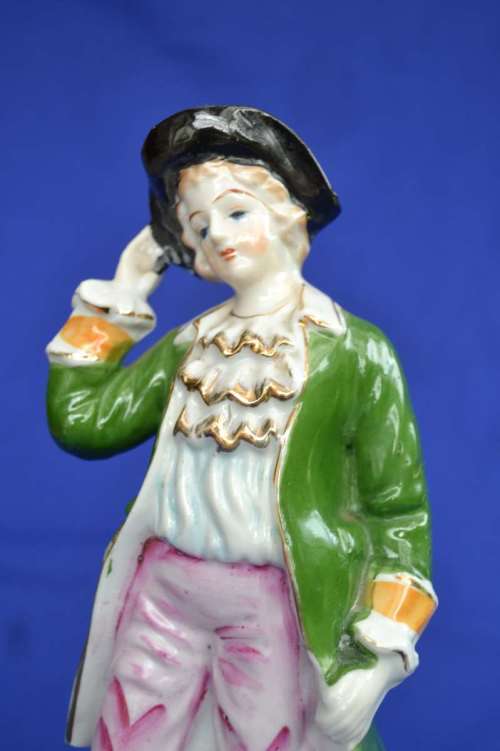 Porcelain Figure of a Young Man In Period Dress