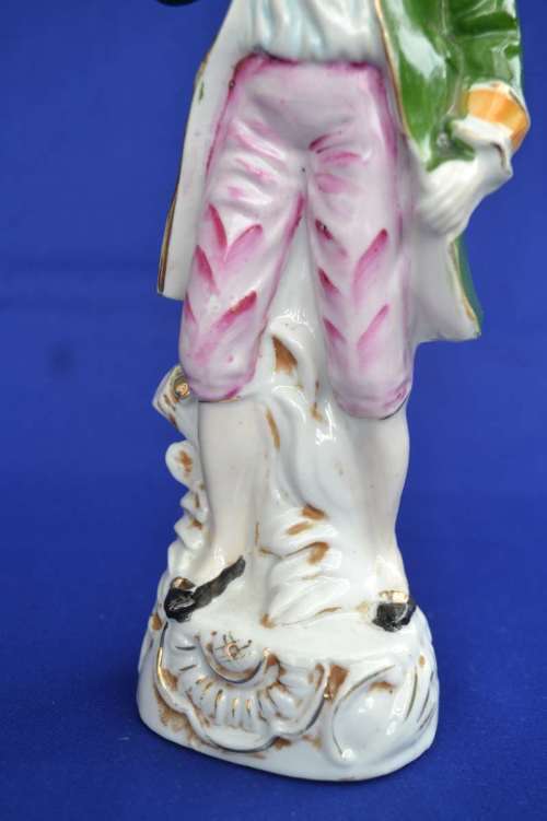 Porcelain Figure of a Young Man In Period Dress