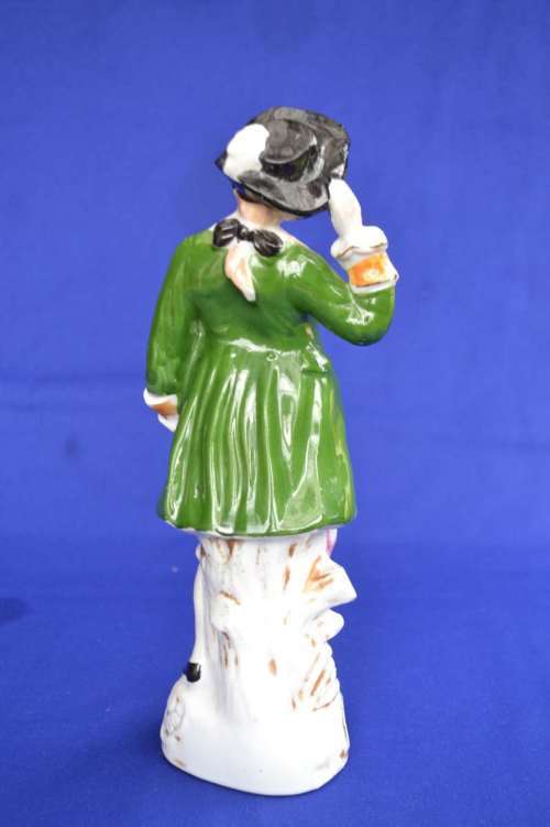 Porcelain Figure of a Young Man In Period Dress