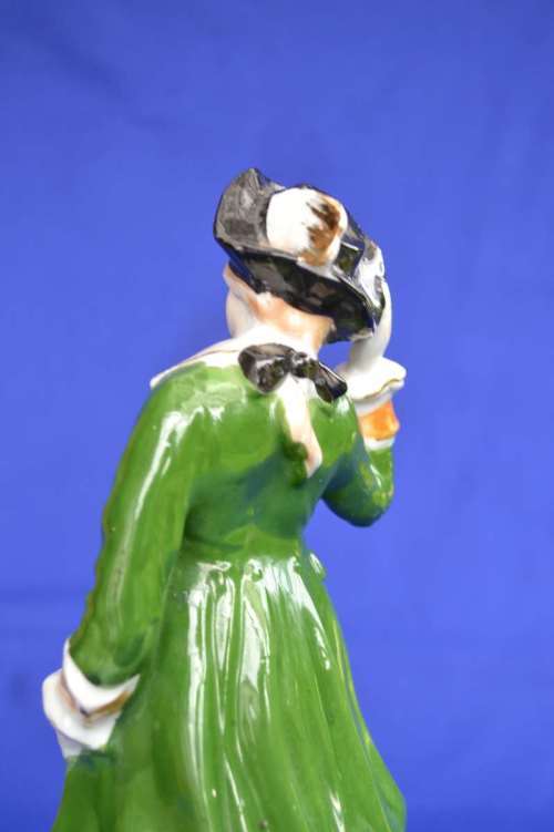 Porcelain Figure of a Young Man In Period Dress