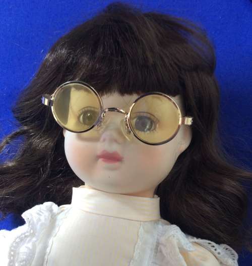 Vintage Porcelain Doll with Glasses
